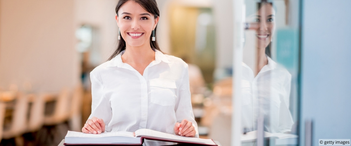 Server assisting guests as they are seated